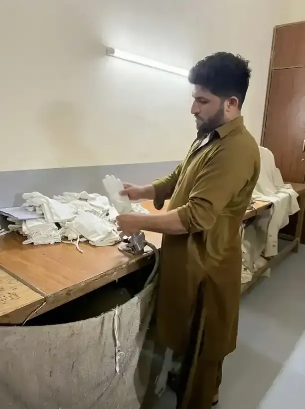 Cotton glove finishing and ironing line at SAS Agencies