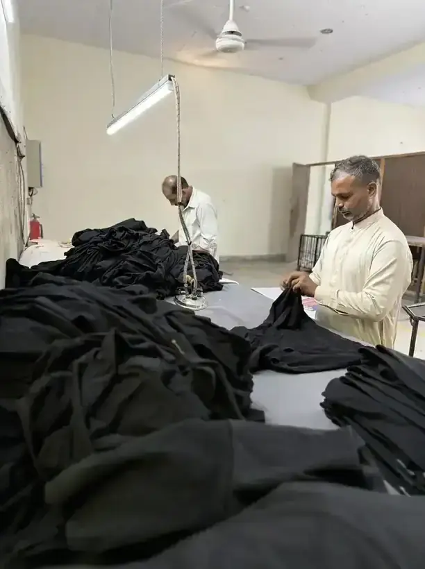 Industrial steam pressing of knit garments at SAS Agencies