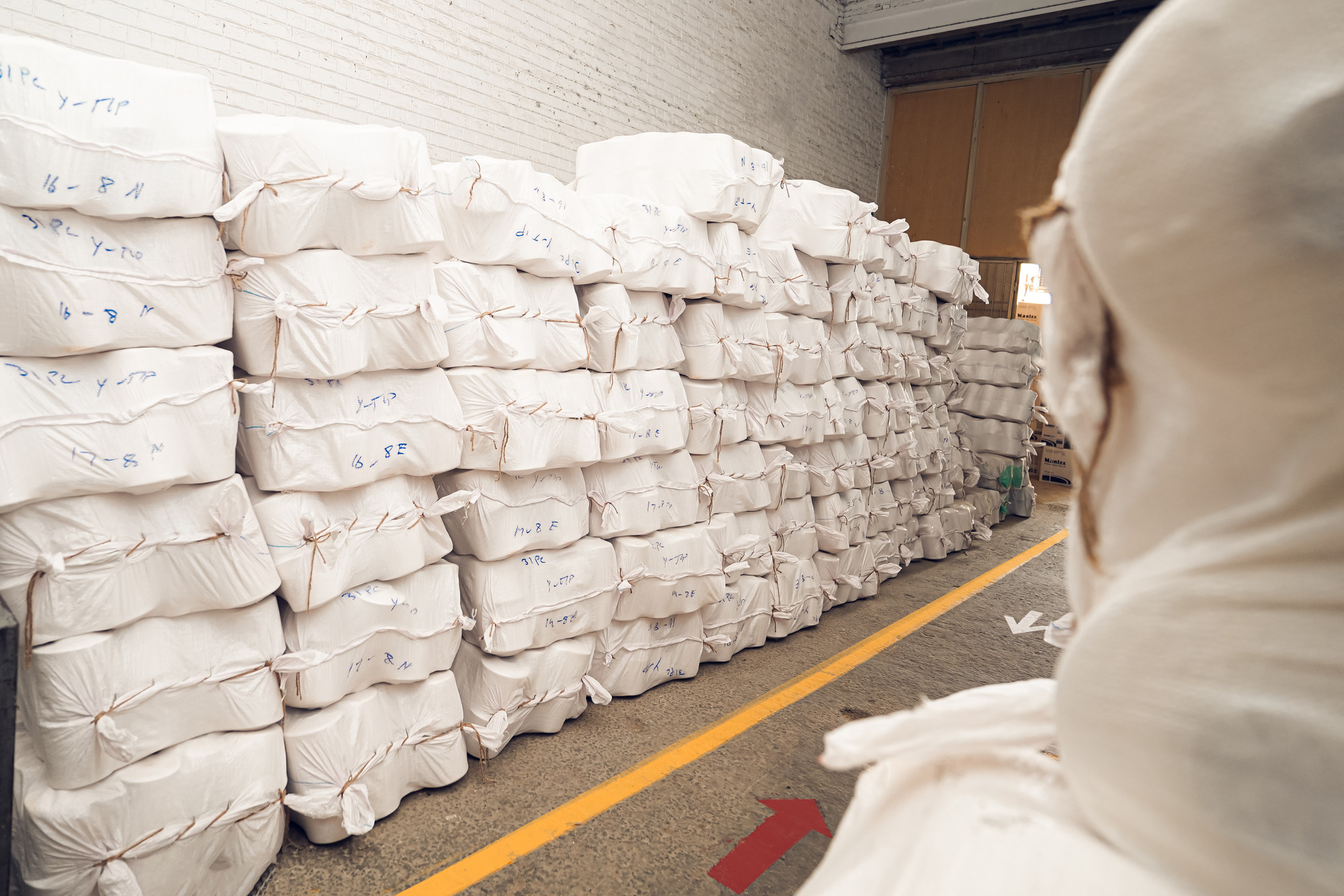 Cotton yarn bales stacked in the SAS Agencies warehouse, from local Faisalabad spinners