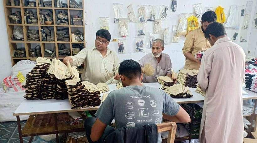 Sample matching and pair sorting station for finished leather gloves at SAS Agencies